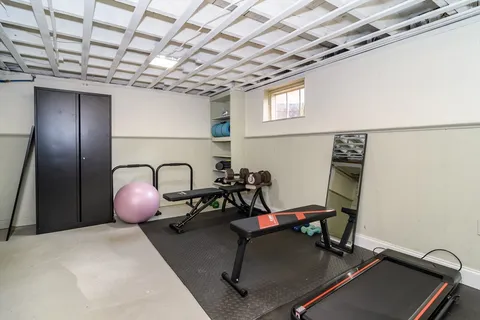 a room with table and gym equipment