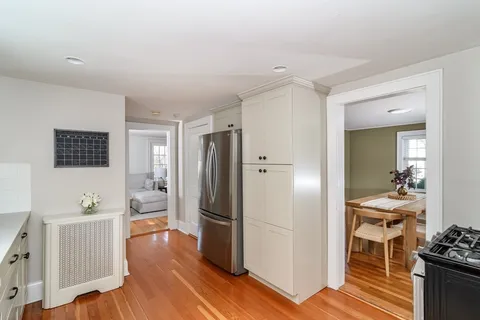 a kitchen with stainless steel appliances kitchen island granite countertop a refrigerator and a stove