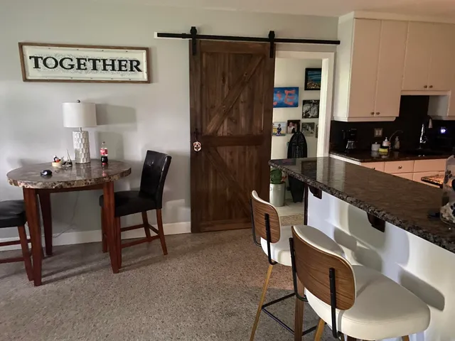 a living room with furniture and a rug