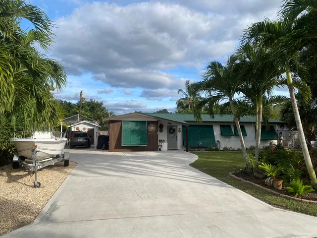 a view of a house with a tree