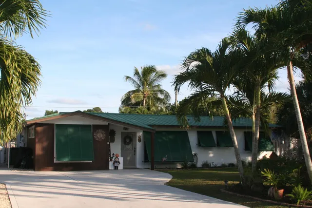 a view of outdoor dining space with a table and chairs