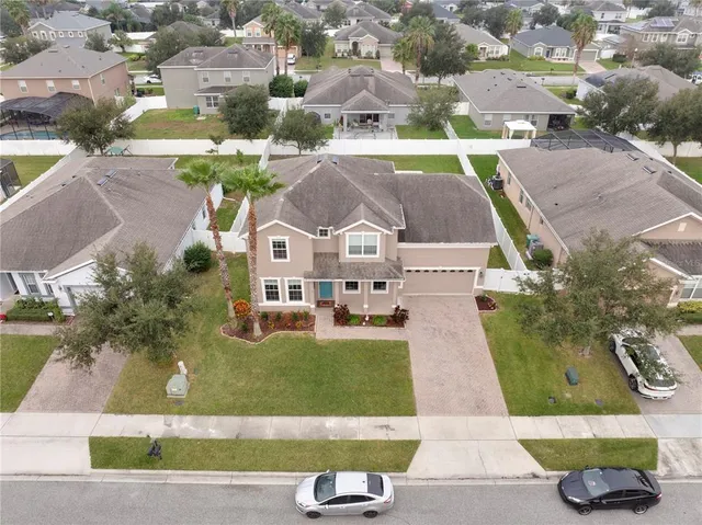 an aerial view of a house with a garden