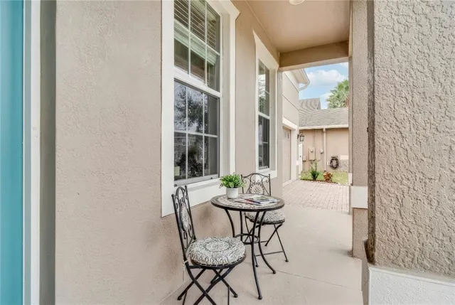 a view of a dining room with furniture and a window