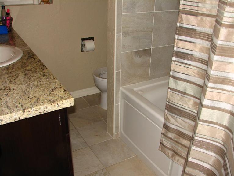 10083 Table Rock Road White City, OR 97503 - Photo 15 of 22 a bathroom with a granite countertop sink and a toilet