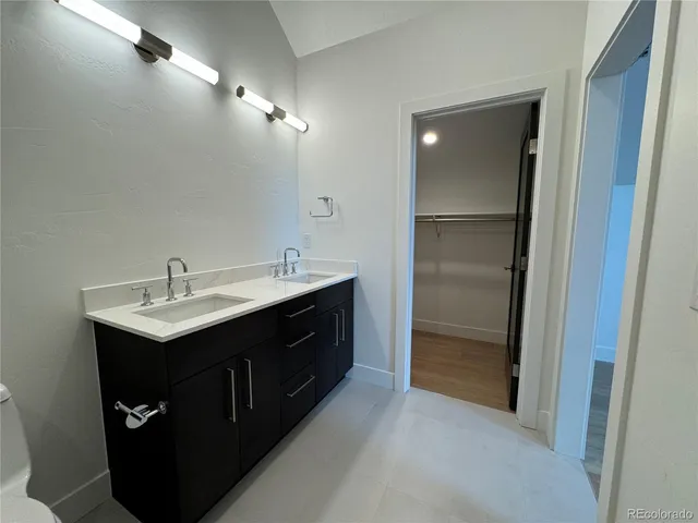 a kitchen with a sink and refrigerator