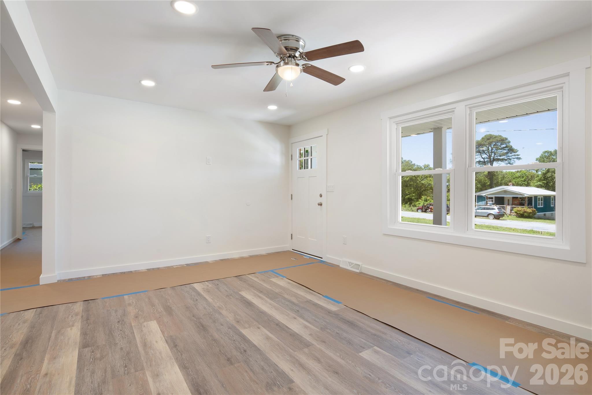 287 Duncan Road Flat Rock, NC 28731 - Photo 6 of 13 wooden floor in an empty room with a window