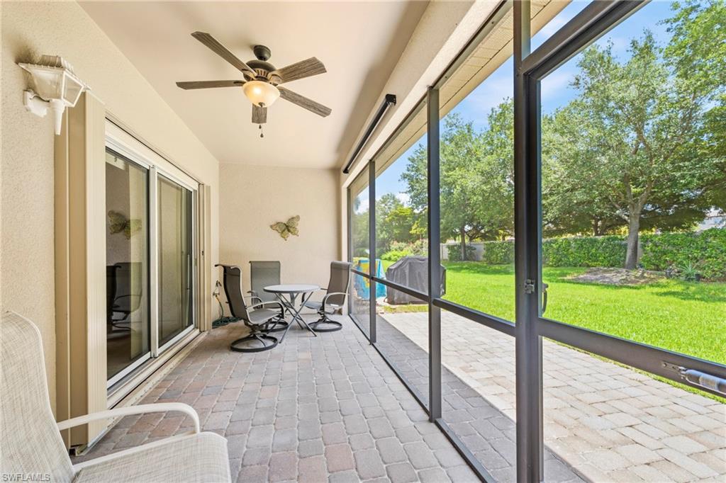 3916 Cherrybrook Loop Fort Myers, FL 33966 - Photo 9 of 31 Screened lanai featuring a paver patio and ceiling fan with integrated lighting