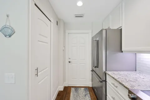 a view of entryway with wooden floor