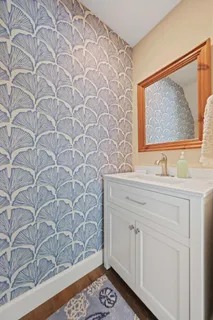 a spacious bedroom with a bed and a flat screen tv