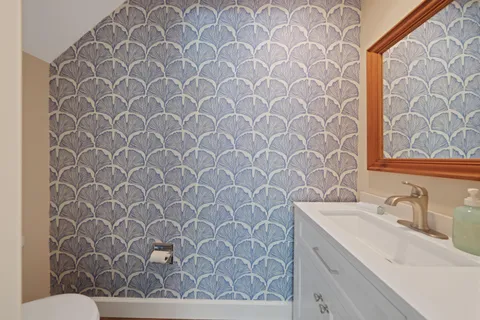 a bedroom with furniture and a flat screen tv