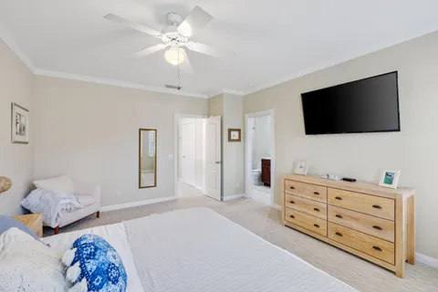 a bathroom with a sink double vanity granite tub shower and a mirror