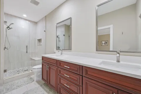 a view of walk in closet with clothes