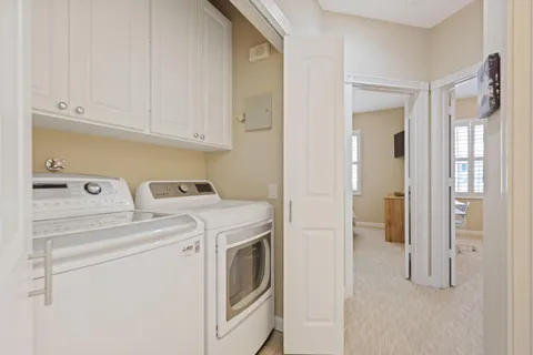 a view of a house with backyard and porch