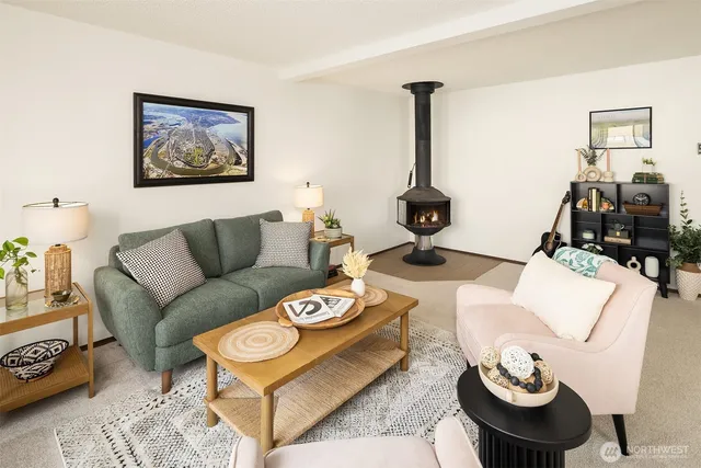 a living room with furniture and a mirror