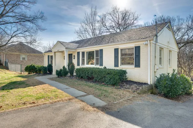 a front view of a house with garden