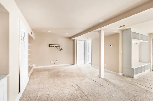 a view of an empty room with a window