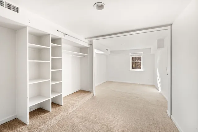 a view of a room with a hallway