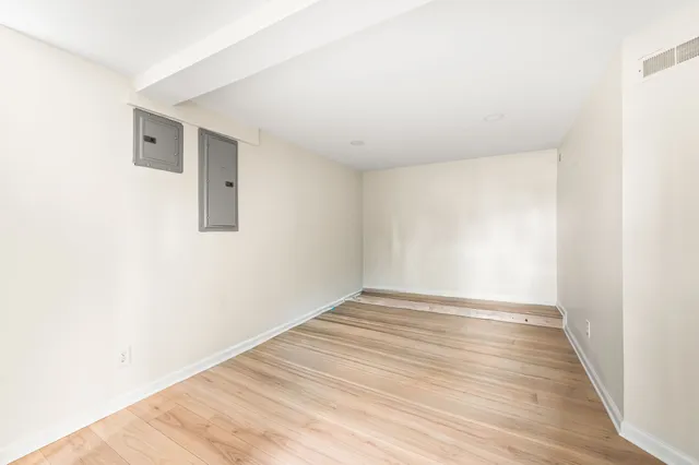 a utility room with a refrigerator and washer