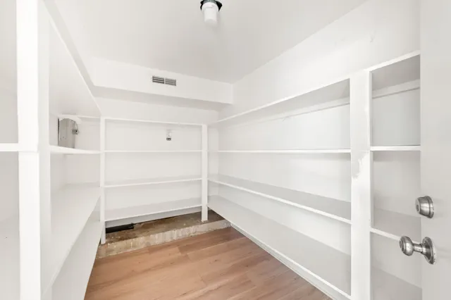 a view of balcony with wooden floor and fence