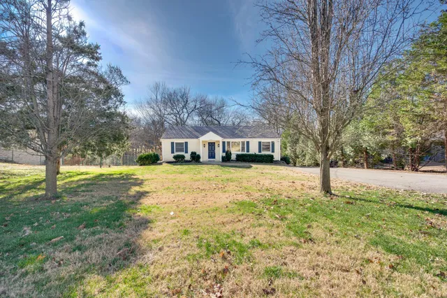 a house with trees in front of it