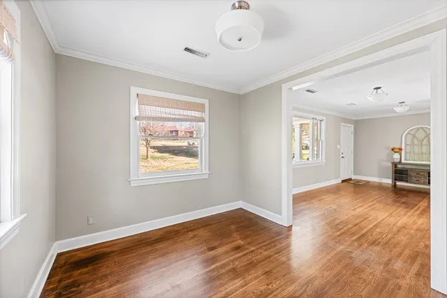 a view of livingroom with hardwood floor and a window