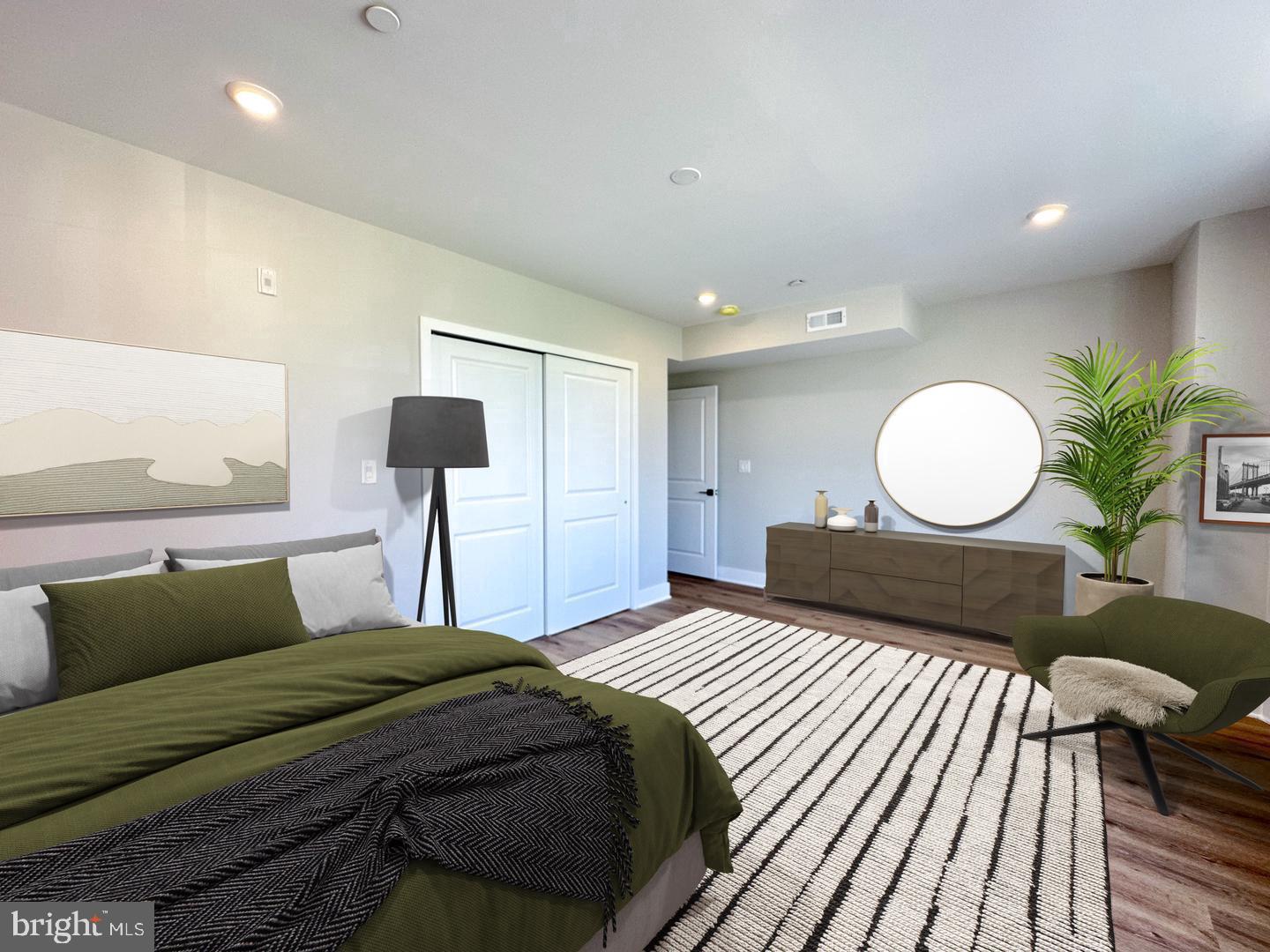 1722 Master Street, Unit 2 Philadelphia, PA 19121 - Photo 6 of 10 a bedroom with a bed and a chandelier