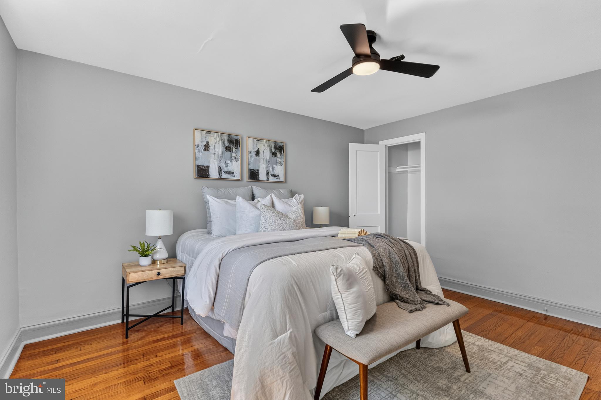 3906 Yolando Road Baltimore, MD 21218 - Photo 10 of 30 a bedroom with a bed and a chandelier