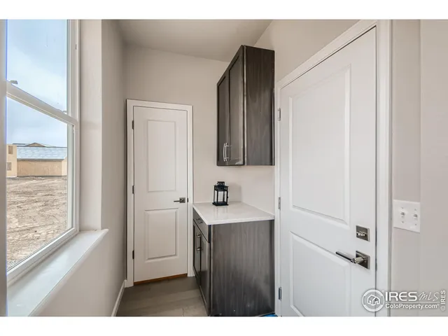 a bathroom with a sink a mirror and a window