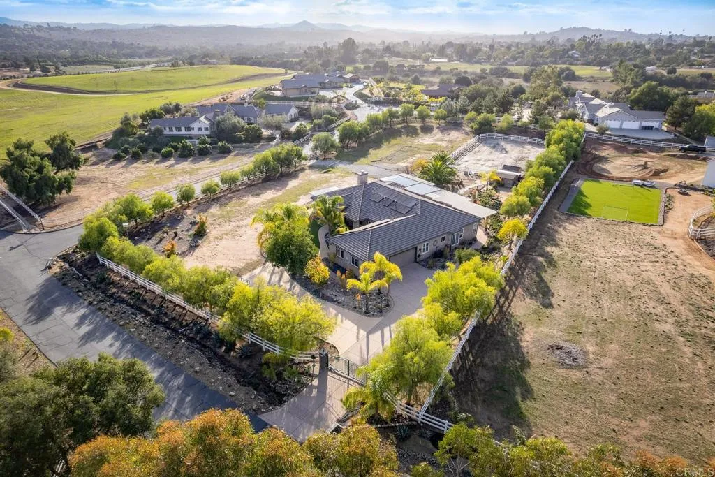 14748 Cool Valley Ranch Road Valley Center, CA 92082 - Photo 1 of 30 an aerial view of residential houses with outdoor space