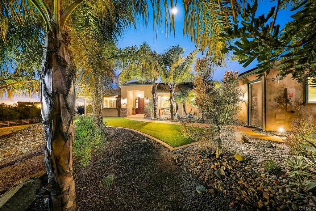14748 Cool Valley Ranch Road Valley Center, CA 92082 - Photo 2 of 30 a view of yard with swimming pool and trees