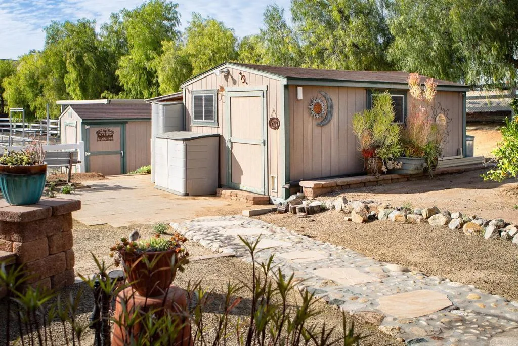 14748 Cool Valley Ranch Road Valley Center, CA 92082 - Photo 25 of 30 a front view of a house with a yard