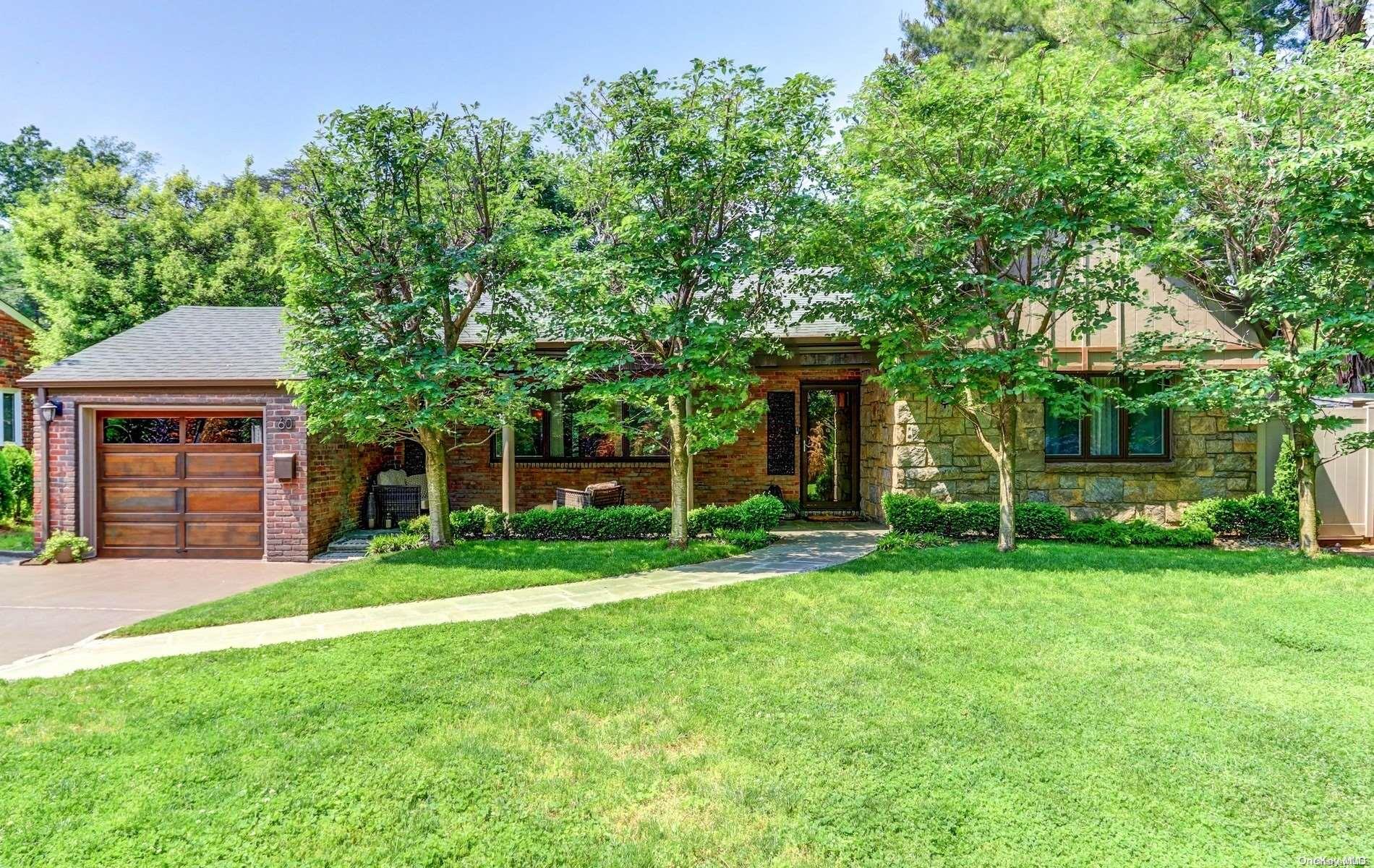 60 Middle Neck Road Roslyn, NY 11576 - Photo 1 of 1 front view of a house with a yard