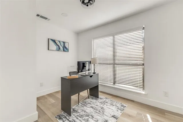 a workspace with furniture and a window