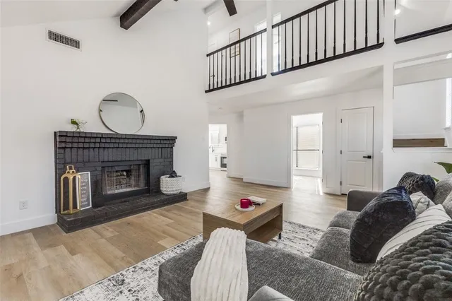 a bedroom with a bed and a fireplace