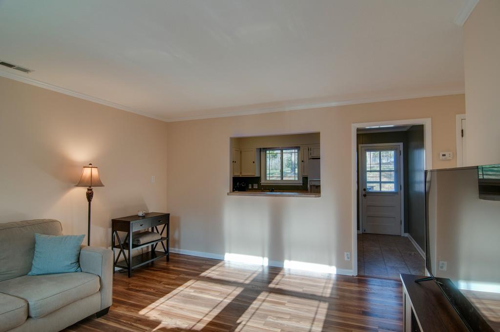 7709 Chester Road Fairview, TN 37062 - Photo 12 of 29 a living room with furniture and a wooden floor
