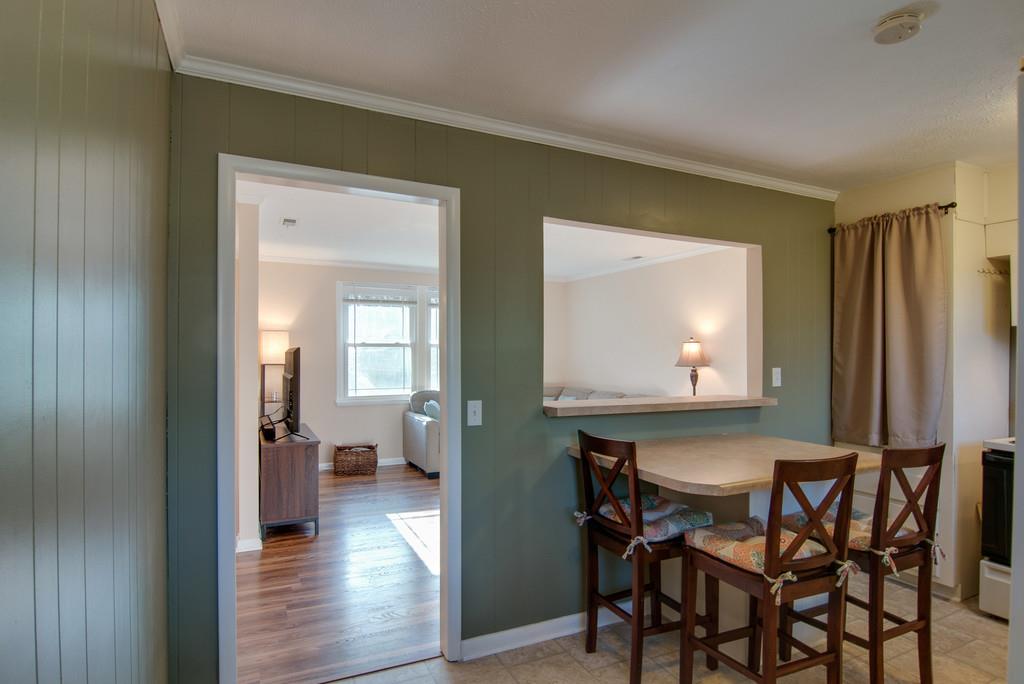 7709 Chester Road Fairview, TN 37062 - Photo 13 of 29 a view of dining room with wooden floor and chairs