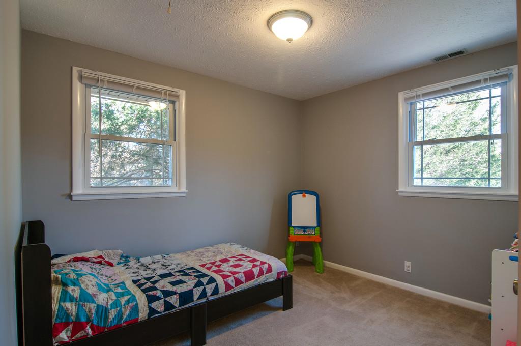 7709 Chester Road Fairview, TN 37062 - Photo 18 of 29 a bedroom with a bed and a window