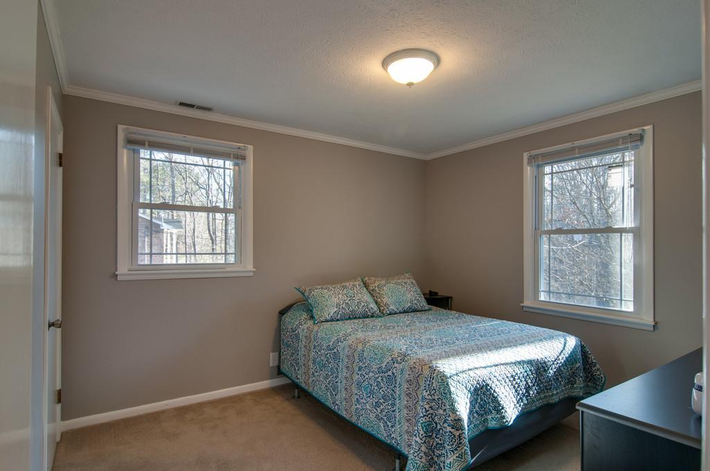7709 Chester Road Fairview, TN 37062 - Photo 19 of 29 a bedroom with a bed and window