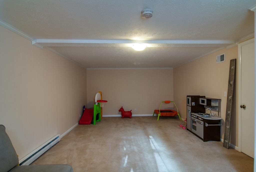 7709 Chester Road Fairview, TN 37062 - Photo 20 of 29 a living room with furniture and a wooden floor