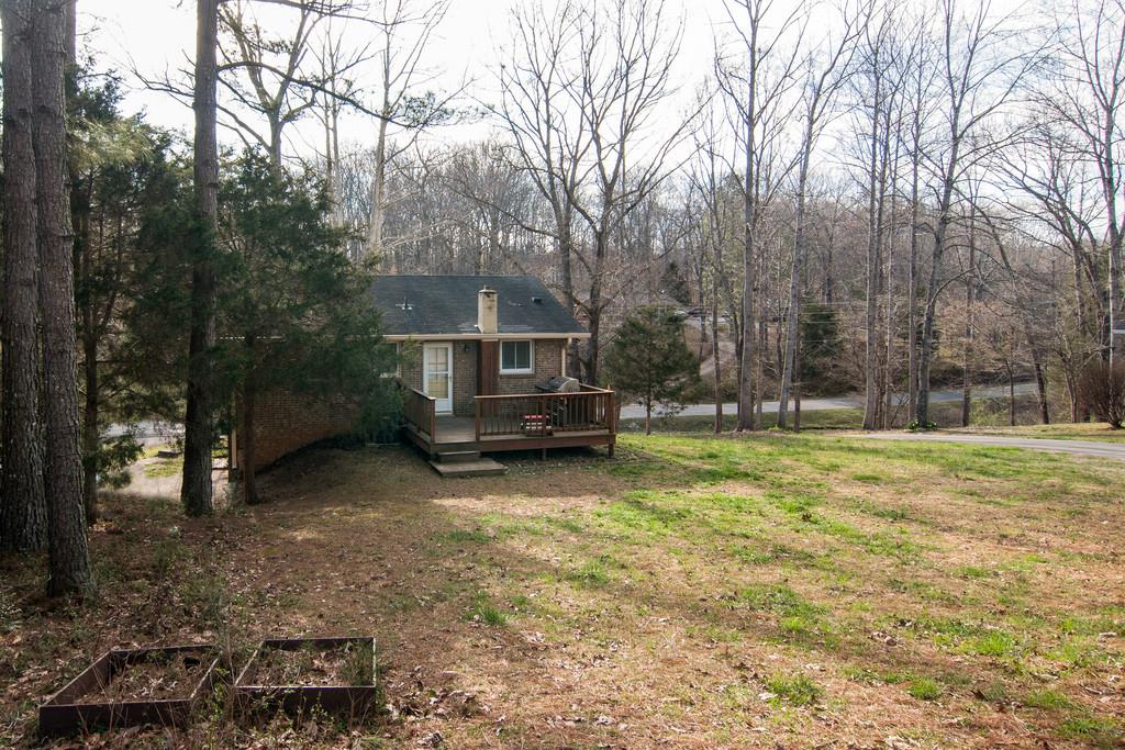 7709 Chester Road Fairview, TN 37062 - Photo 26 of 29 a view of a house with backyard and trees