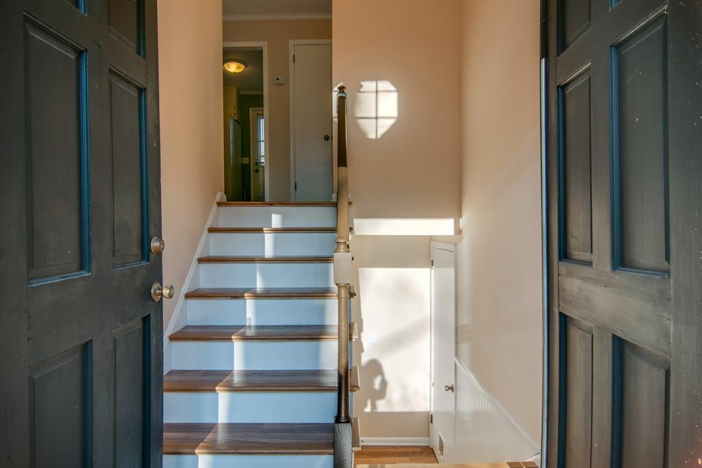 7709 Chester Road Fairview, TN 37062 - Photo 5 of 29 a view of staircase with white walls and windows