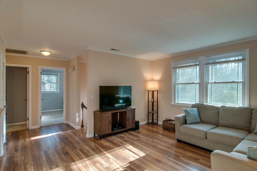 7709 Chester Road Fairview, TN 37062 - Photo 7 of 29 a living room with furniture and a flat screen tv