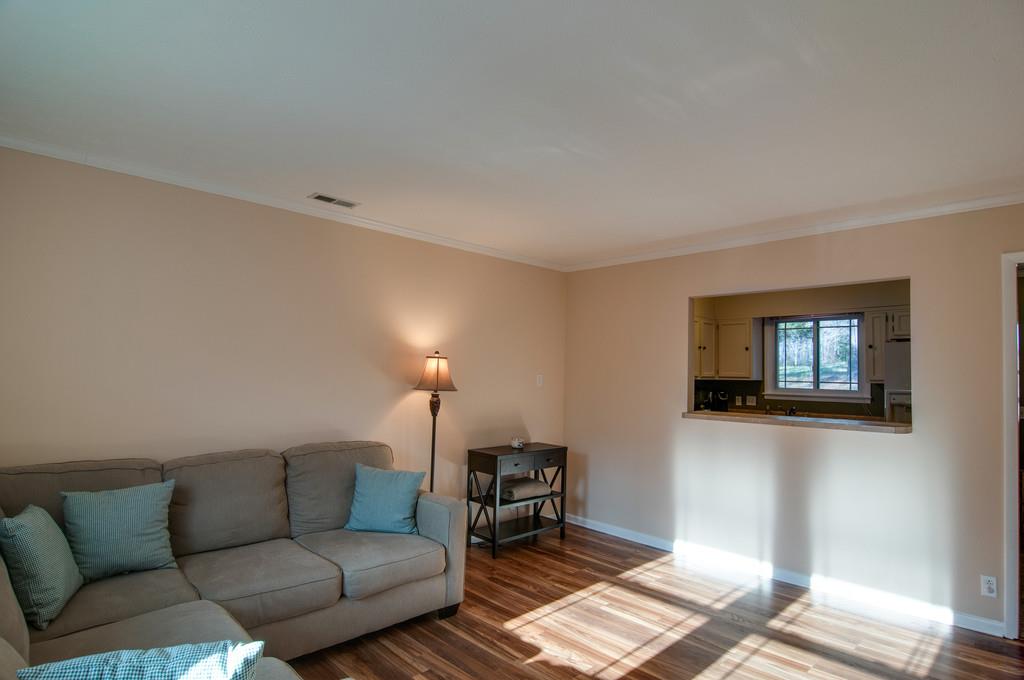 7709 Chester Road Fairview, TN 37062 - Photo 9 of 29 a living room with furniture and a wooden floor