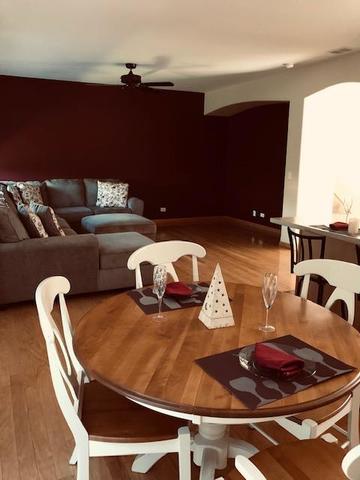 1502 Remington Lane Round Lake, IL 60073 - Photo 9 of 29 a balcony with furniture and a table