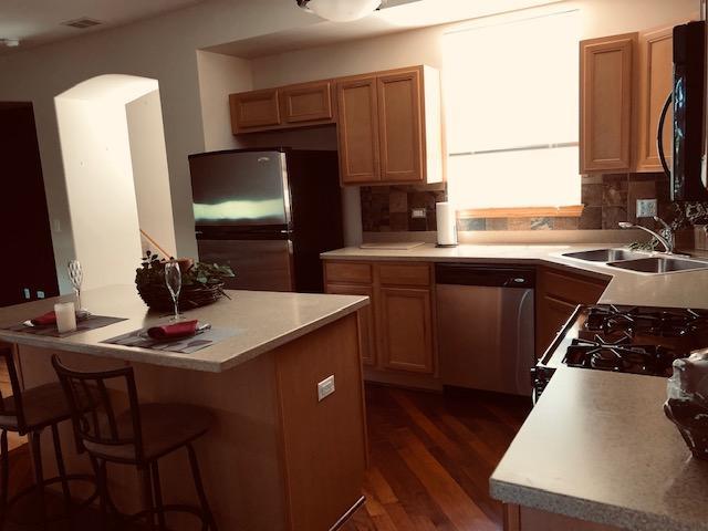 1502 Remington Lane Round Lake, IL 60073 - Photo 10 of 29 a kitchen with a sink appliances and cabinets