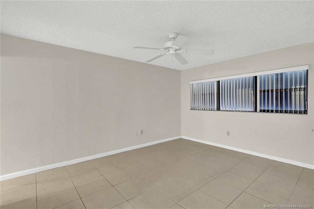 7400 South Ocean Drive, Unit 102 Jensen Beach, FL 34957 - Photo 13 of 26 a view of an empty room with a window