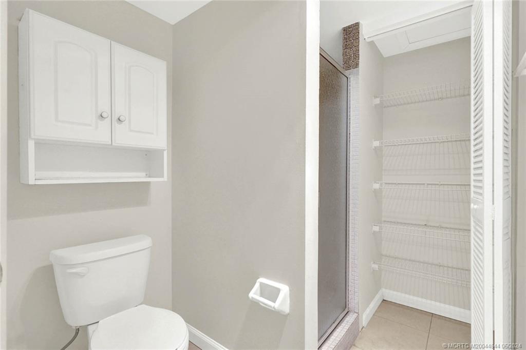 7400 South Ocean Drive, Unit 102 Jensen Beach, FL 34957 - Photo 17 of 26 a bathroom with a toilet