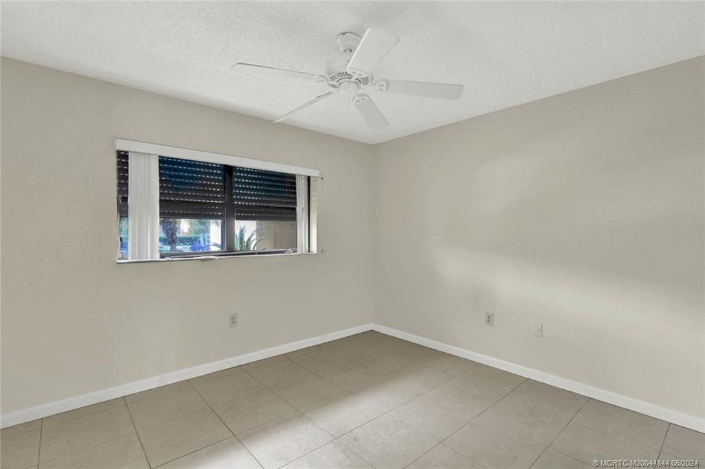 7400 South Ocean Drive, Unit 102 Jensen Beach, FL 34957 - Photo 19 of 26 a view of an empty room with a window