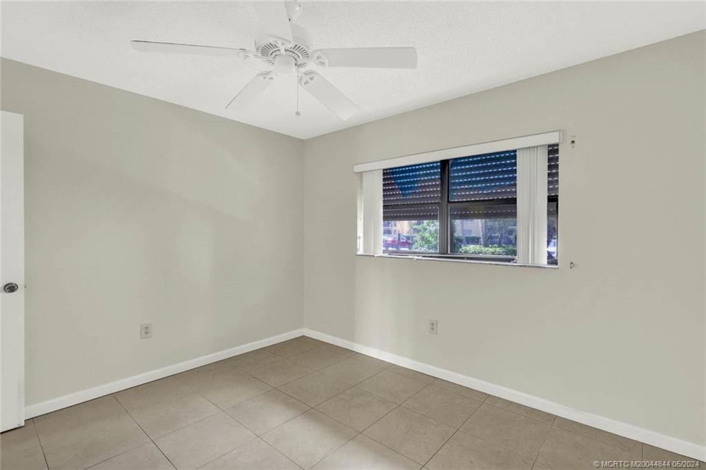 7400 South Ocean Drive, Unit 102 Jensen Beach, FL 34957 - Photo 20 of 26 an empty room with windows