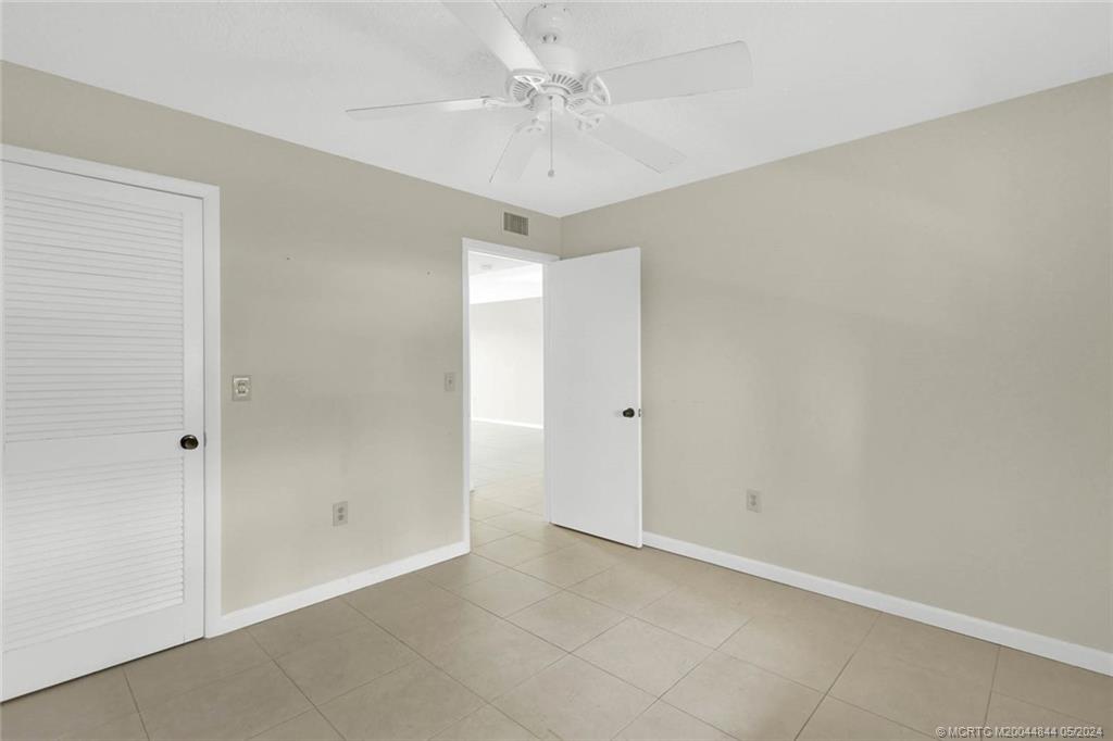 7400 South Ocean Drive, Unit 102 Jensen Beach, FL 34957 - Photo 21 of 26 wooden floor in an empty room